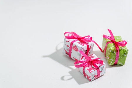Three small gift boxes on a white background, New Year's holiday design