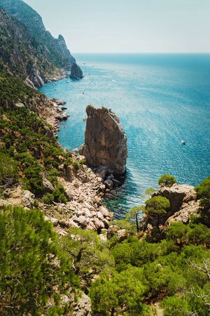 Beautiful sunny summer day on the rocky coast, bay with yachts, The Lost World, Sevastopol, Russiaの写真素材