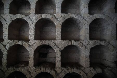 Old ancient winery, niches for bottles of wineの写真素材