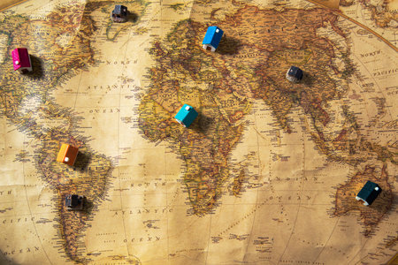 Geographical map of the world with small houses on the continents