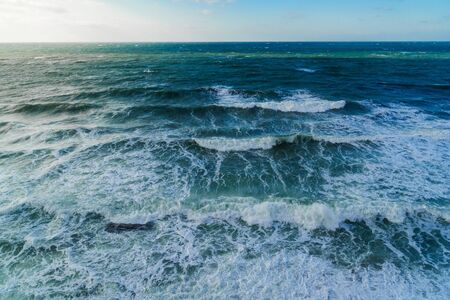 Storm at sea in clear weatherの写真素材