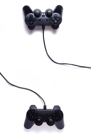 Two black joysticks on a white background, gaming entertainment conceptの写真素材