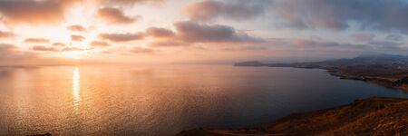 Sunrise over the sea and beautiful cloudscape.の写真素材
