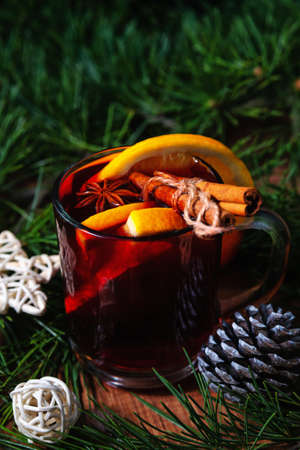 Mulled wine with aromatic spices on a wooden backgroundの写真素材
