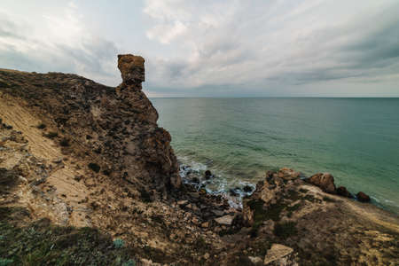 Sunset at the seaside, blue sea, crimson skyの写真素材