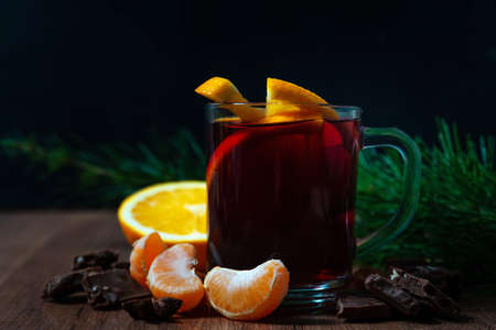 Mulled wine with aromatic spices on a wooden backgroundの写真素材