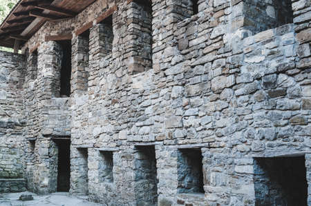 Ancient stone laying of an old destroyed building, decorative backgroundの写真素材