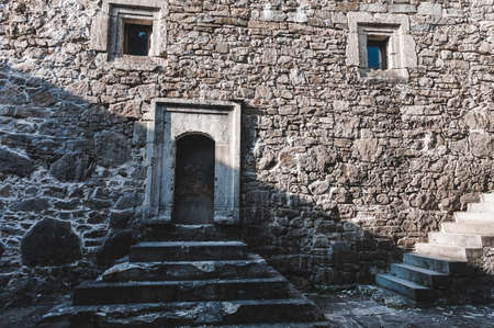 Ancient stone laying of an old destroyed building, decorative backgroundの写真素材