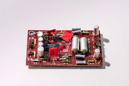 Heap of old soviet microcircuits on a white background, the concept of techno-junk, garbage, pollution, background from electrical componentsの写真素材
