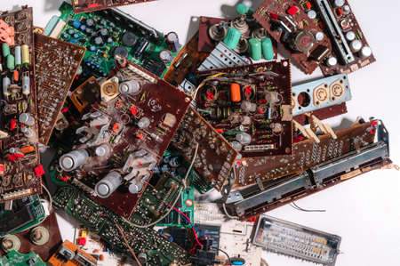 Heap of old soviet microcircuits on a white background, the concept of techno-junk, garbage, pollution, background from electrical componentsの写真素材