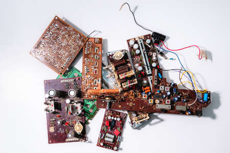 Heap of old soviet microcircuits on a white background, the concept of techno-junk, garbage, pollution, background from electrical componentsの写真素材
