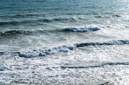 Cold lemonade on the background of the blue sea on a summer sunny dayの写真素材