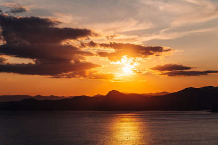 Lilac sunset on the sea coast, quiet sea, resortの写真素材