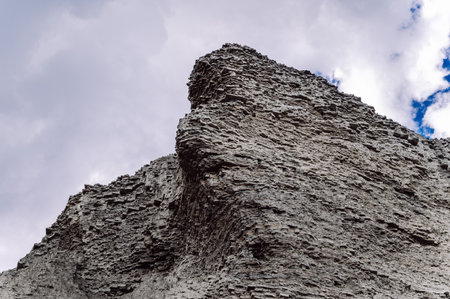 Rocky textured gray clay mountains, natural backgroundの写真素材