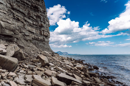 Rocky textured mountains on the seashoreの写真素材