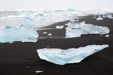 Diamond Beach in Iceland. Incredible Landscape with Pure Blue Icebergs on Black Sand. Shore Near...