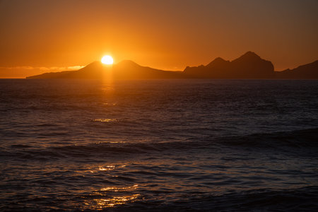 Sunrise over Stormy Sea, Shining Golden Waves with Sun Reflection, Amazing light over Iceland Nature