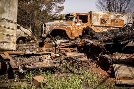 Building and car destroyed by fire during australian bushfiresの写真素材