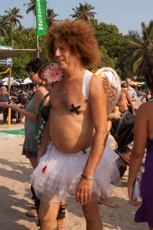An unidentified man goes in Funny angel costume at the annual festival of Freaks, Arambol beach, Goa, India, February 5, 2013  Tourists put on crazy homemade costumes and show funny performances on the beach のeditorial素材