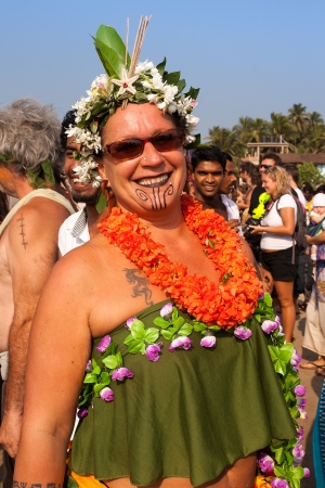 An unidentified woman in a flower costume at the annual festival of Freaks, Arambol beach, Goa, India, February 5, 2013  Tourists put on crazy self-made costumes and show funny performances on the beach のeditorial素材