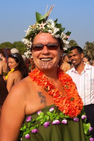 Arambol, Goa - February 5, 2013  An unidentified woman in a flower costume at the annual festival of Freaks, Arambol beach, Goa, India, February 5, 2013  Yearly February festival of freaks in Arambol is a continuation of the traditions of hippies のeditorial素材