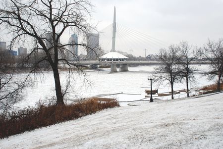 Winnipeg skyline with Provencher Bridge and spire from St Bonifaceのeditorial素材