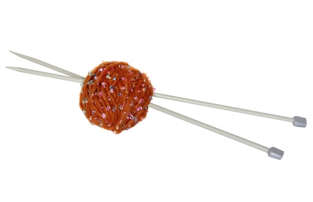 A ball of brown yarn and knitting needlesの写真素材