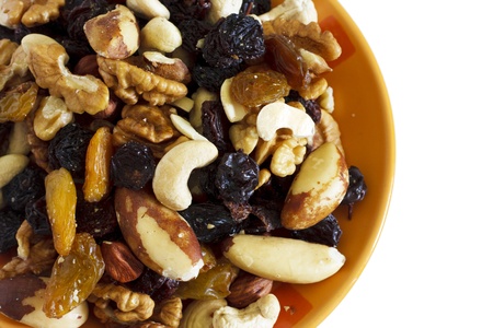 Dried fruits and nuts on the orange bowlの写真素材