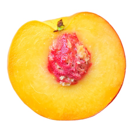 Half a peach isolated on white backgroundの写真素材