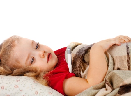Little girl lying in bedの写真素材