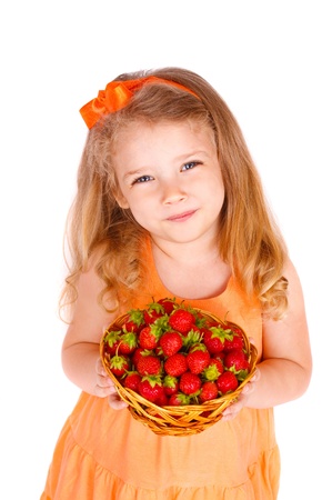 Happy little girl with strawberriesの写真素材
