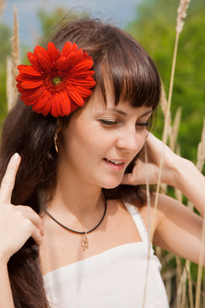 Portrait of a young woman on natureの写真素材