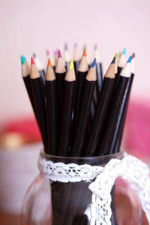 Stack of colored pencils in a glassの写真素材