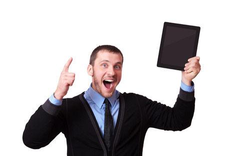 A man with a tablet in his hand and raised his finger up, isolated on whiteの写真素材