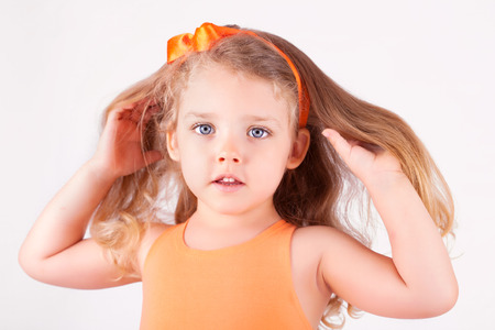 Portrait of a little girl on white backgroundの写真素材