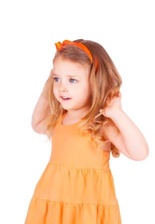 Cute little girl smiling, isolated on white backgroundの写真素材