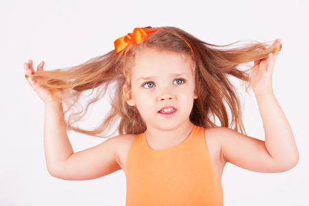 Portrait of a little girl on white backgroundの写真素材