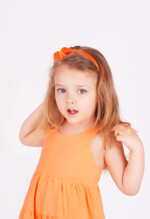 Portrait of a little girl on white backgroundの写真素材