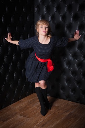Portrait of a beautiful woman in a black dressの写真素材