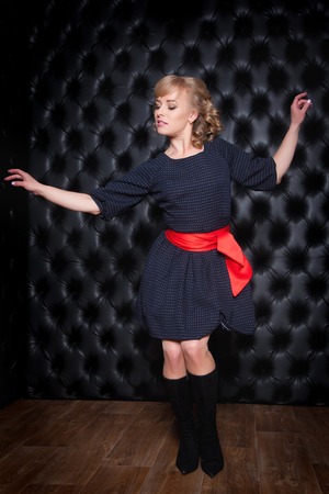 Portrait of a beautiful woman in a black dressの写真素材