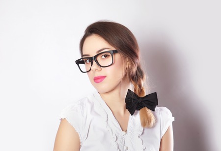 Portrait of young beautiful brunette womanl in glassesの写真素材