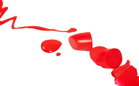 Red lipstick and nail polish isolated on white backgroundの写真素材