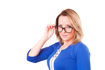 Portrait of a woman in glasses and blue dress, isolated on white backgroundの写真素材