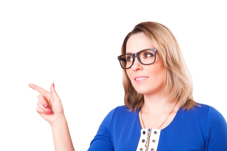 The woman points a finger. Studio shot. Isolated on white backgroundの写真素材