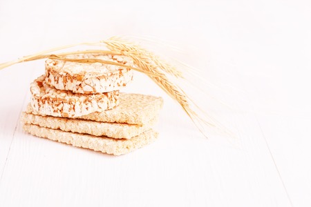 Dietary a low caloric grain crackers on a white backgroundの写真素材