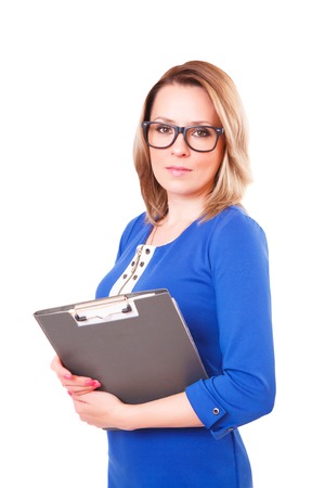 Portrait of a woman in glasses and with folder in her hands, isolated on white backgroundの写真素材