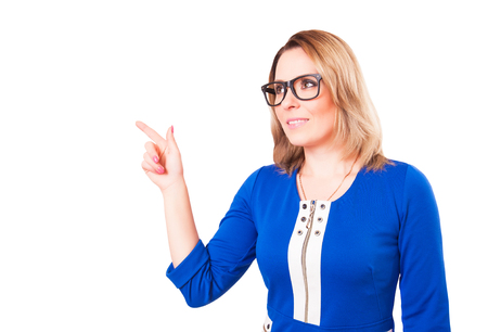 The woman points a finger. Studio shot. Isolated on white backgroundの写真素材