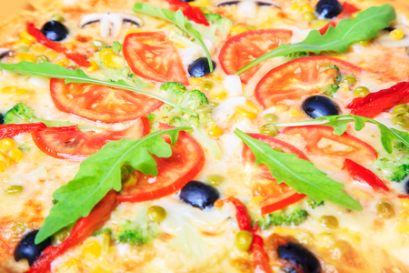 Delicious pizza with vegetables close-up, food backgroundの写真素材