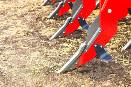 Plough close-up on the ground, farm equipmentの写真素材