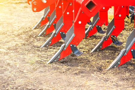 Plough close-up on the ground, farm equipmentの写真素材